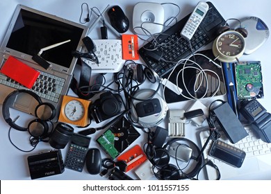 Pile of used Electronic Waste on white background, Reuse and Recycle concept, Top view  - Shutterstock ID 1011557155
