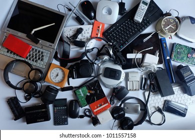 Pile of used Electronic Waste on white background, Reuse and Recycle concept, Top view 