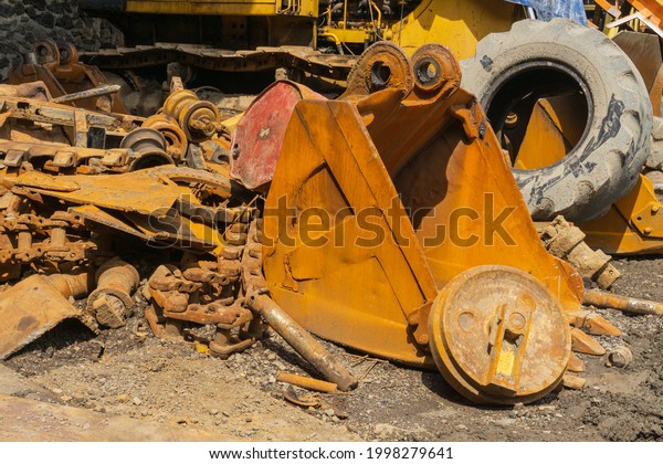 pile of used vehicles in a\
factory
