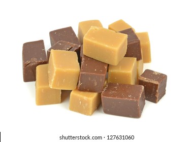 A Pile Of Vanilla And Chocolate Fudge On A White Background