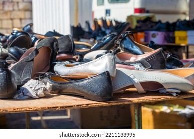 Pile Of Various Female Shoes Pile Of Various Men  In The Market,Market Street Shoes For The Poor Population ,different Models Of Old Female Footwear Close Up On Big Pile Of Colorful Shoes. 