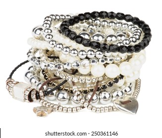 Pile Of Various Pearl, Silver And Black Jewelry Gems Bracelets Isolated On White Background