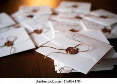 pile of vintage wax sealed invitation envelopes or old fashioned retro letters