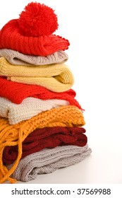 Pile Of Warm Clothes On White Background