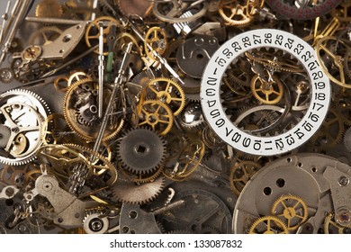 Pile of watch parts with date ring on top