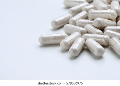 Pile Of White Capsules Probiotic Powder Inside. Copy Space. High Resolution Product. Health Care Concept