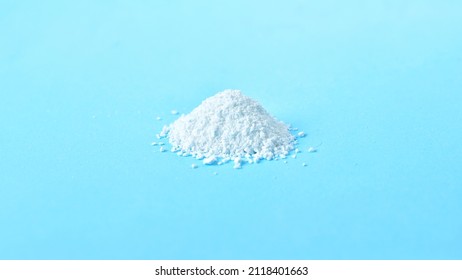 Pile Of White Medicinal Powder On Blue Background