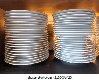 
Pile Of White Plates In Cutlery Storage Cupboard.
Prepared To Serve Guests Who Will Eat At This Restaurant.
