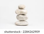 pile of white stones isolated on white background. Stones pyramid. Life balance and harmony concept             