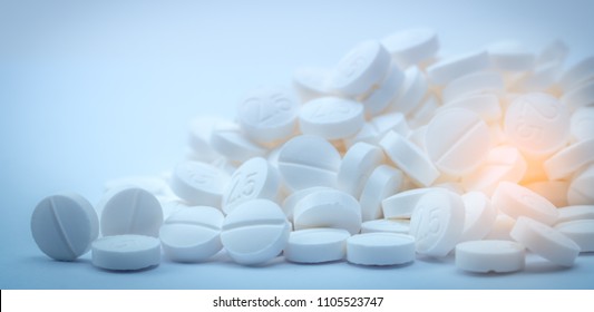 Pile Of White Tablets Pills. Bronchodilator Drug For Treatment Asthma. Pharmaceutical Industry. Global Healthcare. Health And Medicine Policy Concept. Pharmacy Products. Pharmaceutical Production.