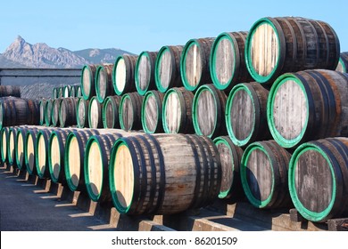 A Pile Of Wine Barrels On Madeira Wine-yard