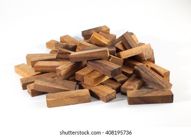 A Pile Of Wood Fell From Wooden Blocks Tower Isolated On White Background