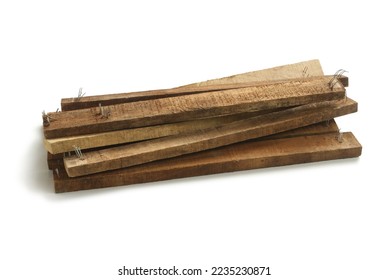 Pile of wood scrap isolated on white background - Shutterstock ID 2235230871