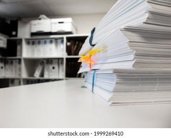 Pile of workfiles on desk in office business files
