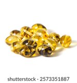 A pile of yellow and brown gemstones. The stones are small and round, and they are arranged in a pile. The stones are not uniform in size or shape, and they have a natural, earthy appearance