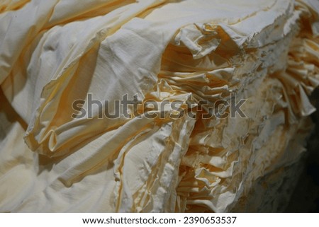 A pile of yellow cloth compiled.