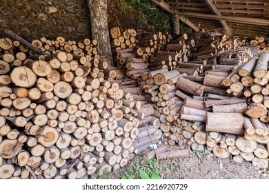 Piled Up Logs For Fireplaces In A Shed, No People Shown