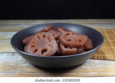 Piled Of Lotus Root In Syrup Serving In The Bowl. Famous Sweet Dessert In Chinese Restaurant. 