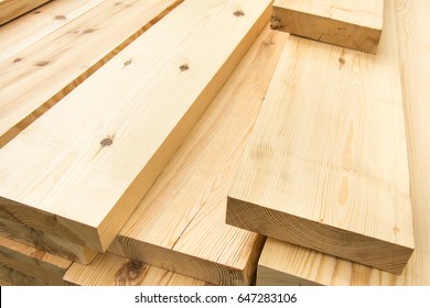 Piled lumber near a lumber mill, waiting for shipping. Wood Mill. Lumber and wood slice. - Shutterstock ID 647283106