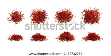 Piles of aromatic saffron isolated on white, top and side views
