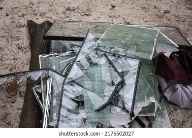 Piles of broken glass from windows from the apartment buildings were was knocked out by the blast wave as a result of by the Kalibr cruise missile airstrike at of the full-scale Ru invasion of Ukraine