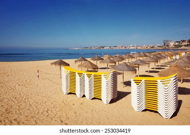 Piles of deck chairs in a beach in Estoril, Portugal