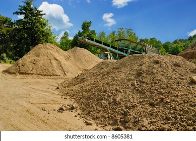 Piles Of Dirt Being Sifted For Construction