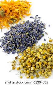 Piles Of Dried Medicinal Herbs Camomile, Lavender, Calendula On White Background