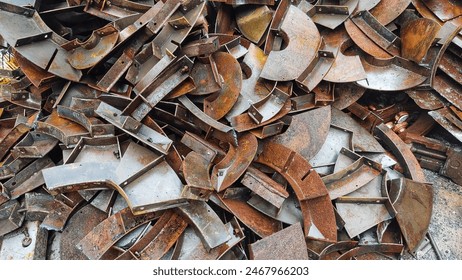 piles of industrial iron waste, environmental pollution from metal waste, rusting of scrap metal. - Powered by Shutterstock