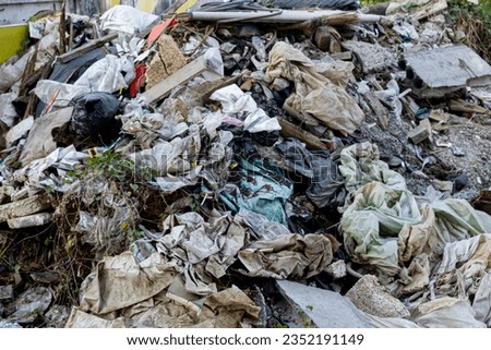 piles of plastic, wood and metal waste at project or community sites