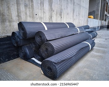 Piles of rolled membrane waterproofing. Rolls of insulation material - Shutterstock ID 2156965447