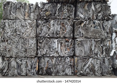 Piles of scrap metal bundled in bales for recycling
