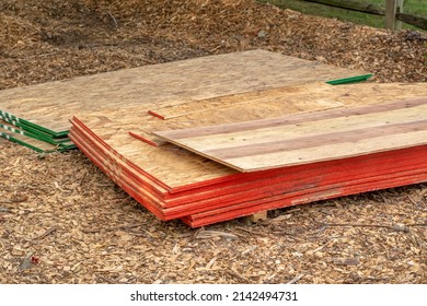 Piles Of Sheeting Are Set On Pallets At A Job Site Of A New Home Addition