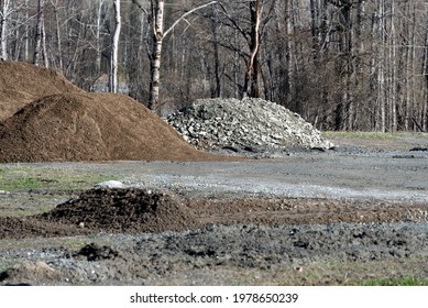 Piles Of Soil And Loose Gravel In A Field