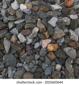 Piles Of Stones That Are Broken Into Small Pieces And Placed Around The Railroad Tracks