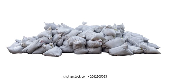 The piles of white sandbags were piled on top of each other all over the floor. huge pile of sand bags. Isolated.