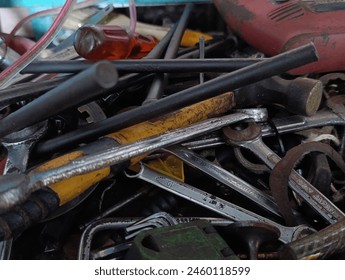 piles of workshop tools scattered around