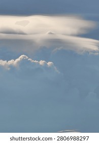 Pileus Cap Cloud with Pointed Peak Above a Growing Cumulus Tower