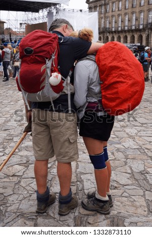 Pilgrim couple who have arrived on foot to Santiago of Compostela, Galicia, Spain                              