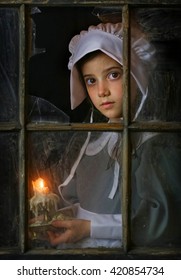 Pilgrim Girl With Candle By Window