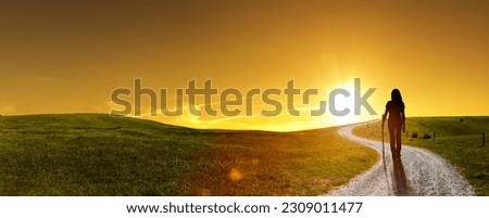 Pilgrim on the way through a hilly landscape
