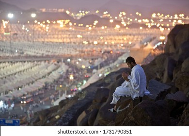 Pilgrim Seeking Solitude In One Of The Mountains Of Mina, Saudi Arabia, During The Hajj Season Of 2015