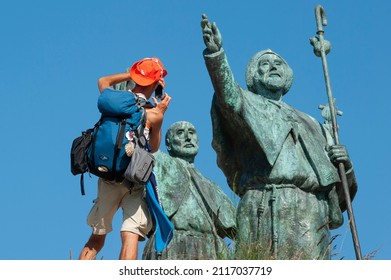 A Pilgrim Takes A Picture On The Way Of Saint James At The Gozo Mount, Close To Santiago De Compostela, Spain, On August 21, 2014. 