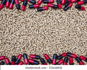 Pill Capsules On Pelleted Feed As Background, Antibiotics In Animal Feed Concept.