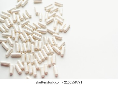 Pill capsules on a white background. Vitamins on a white background. - Shutterstock ID 2158559791