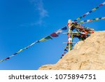 Pillar of colorful flags with vivid color use as tailsman for safety travel in tibetan on mountain hill, Leh - India