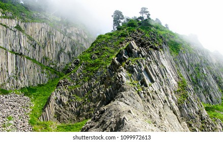 Pillar Rocks of Stolbchatiy cape in Kunashir, Kuril islands, Russia - Shutterstock ID 1099972613