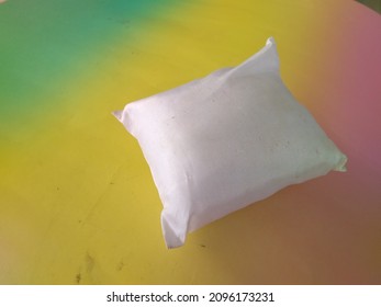 a pillow filled with a small white cork