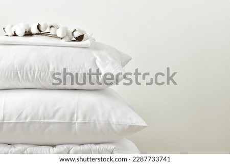 Pillows and blanket on a white background