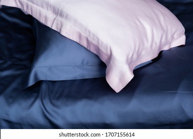 Pillows in blue and pink silk. Silk pillowcases. Satin bedding. - Shutterstock ID 1707155614